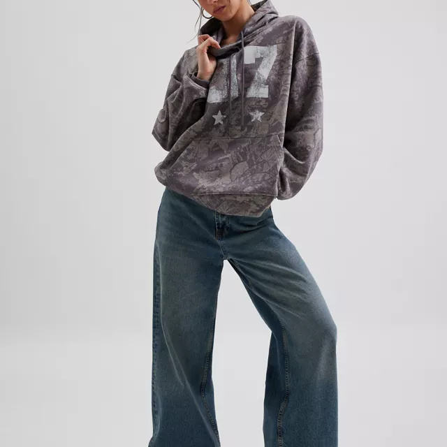 Camo Graphic Hoodie Sweatshirt in a Relaxed Fit with a Gray Toned Leaf Pattern Featuring Distressed Number 7 and Star Graphics.
